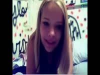 Sexy teen shows off her huge tits while playing on webcam